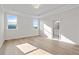 Spacious main bedroom featuring wood floors, natural light, and a bathroom at 1682 Juniper Berry Way, Loganville, GA 30052