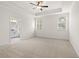 Large main bedroom with ceiling fan and ensuite bathroom at 1682 Juniper Berry Way, Loganville, GA 30052