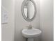 Powder room featuring pedestal sink with modern fixtures at 1682 Juniper Berry Way, Loganville, GA 30052