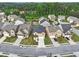 Aerial view of a neighborhood with houses and yards at 1862 Weatherbrook Cir, Lawrenceville, GA 30043