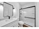 Modern bathroom with white vanity and frameless shower at 1862 Weatherbrook Cir, Lawrenceville, GA 30043