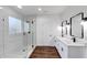 Modern bathroom with double vanity, walk-in shower, and marble tile at 1862 Weatherbrook Cir, Lawrenceville, GA 30043