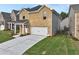 Two-story brick home with a side view showcasing landscaping at 1862 Weatherbrook Cir, Lawrenceville, GA 30043