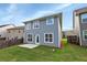 Two-story house with gray siding and a backyard patio at 1862 Weatherbrook Cir, Lawrenceville, GA 30043