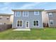 Two-story house with gray siding and a backyard patio at 1862 Weatherbrook Cir, Lawrenceville, GA 30043