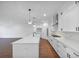 Modern kitchen with white cabinets, quartz countertops and island at 1862 Weatherbrook Cir, Lawrenceville, GA 30043