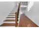 Open staircase with wooden handrail and metal balusters at 1862 Weatherbrook Cir, Lawrenceville, GA 30043