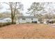 Large backyard with mature trees and a wooden deck at 3164 Delmar Nw Ln, Atlanta, GA 30311