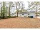 Large backyard with mature trees and a wooden deck at 3164 Delmar Nw Ln, Atlanta, GA 30311