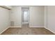 Spacious finished basement with neutral carpeting and multiple rooms at 3164 Delmar Nw Ln, Atlanta, GA 30311