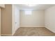 Finished basement room featuring a window and neutral wall colors at 3164 Delmar Nw Ln, Atlanta, GA 30311