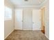 Spacious bedroom with neutral walls, carpet, and two doors at 3164 Delmar Nw Ln, Atlanta, GA 30311