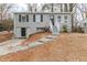 Gray brick ranch house with a gray door and steps leading to the entrance at 3164 Delmar Nw Ln, Atlanta, GA 30311