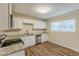 Renovated kitchen with white cabinets, granite countertops, and stainless steel appliances at 3164 Delmar Nw Ln, Atlanta, GA 30311