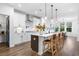 Modern kitchen with island, stainless steel appliances, and white cabinetry at 1610 Savory Way, Loganville, GA 30052