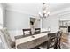 Bright dining room featuring a wood table and kitchen views at 1111 Lauren Nw Way, Acworth, GA 30101