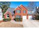 Two-story home with a two-car garage and manicured lawn at 1111 Lauren Nw Way, Acworth, GA 30101