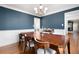 Elegant dining room features hardwood floors and a large wooden dining table at 1227 Independence Way, Marietta, GA 30062