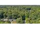 High-angle view of houses nestled in a lush, wooded area at 1626 Kenmore Sw St, Atlanta, GA 30311