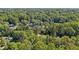 Aerial view of homes surrounded by a vast green forest at 1626 Kenmore Sw St, Atlanta, GA 30311