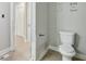 Simple bathroom with toilet and updated vanity at 1626 Kenmore Sw St, Atlanta, GA 30311