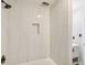 Modern bathroom with a bathtub and marble shower surround at 1626 Kenmore Sw St, Atlanta, GA 30311