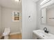 Clean bathroom with toilet and updated vanity at 1626 Kenmore Sw St, Atlanta, GA 30311