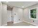 Bedroom with hardwood floors, closet and window at 1626 Kenmore Sw St, Atlanta, GA 30311
