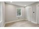 Well-lit bedroom featuring hardwood floors and a window at 1626 Kenmore Sw St, Atlanta, GA 30311