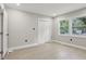 Well-lit bedroom featuring hardwood floors and double closets at 1626 Kenmore Sw St, Atlanta, GA 30311