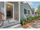 House entrance with wooden railing and steps at 1626 Kenmore Sw St, Atlanta, GA 30311