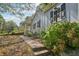 Charming home featuring a well-maintained yard and inviting walkway to the front porch at 1626 Kenmore Sw St, Atlanta, GA 30311