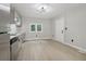 Modern kitchen with gray cabinets and stainless steel appliances at 1626 Kenmore Sw St, Atlanta, GA 30311