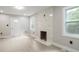 Bright living room featuring hardwood floors and a modern fireplace at 1626 Kenmore Sw St, Atlanta, GA 30311