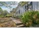 Landscaped side yard with walkway leading to the house entrance at 1626 Kenmore Sw St, Atlanta, GA 30311