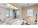 Main bathroom with a shower/tub combo, vanity, and grab bars at 4002 Cheoah Dr, Douglasville, GA 30135