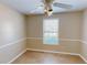 Bright bedroom with hardwood floors and a ceiling fan at 4002 Cheoah Dr, Douglasville, GA 30135