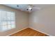 Charming bedroom with hardwood floors and a ceiling fan at 4002 Cheoah Dr, Douglasville, GA 30135