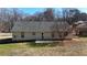 Rear view of house showing patio and yard at 4002 Cheoah Dr, Douglasville, GA 30135