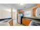 Cozy kitchen features wood cabinets, stainless steel appliances, and a double sink at 4002 Cheoah Dr, Douglasville, GA 30135