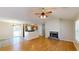 Living room with hardwood floors, fireplace and kitchen view at 4002 Cheoah Dr, Douglasville, GA 30135