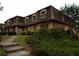 Attractive exterior of a multi-unit building, featuring a unique roofline and landscaping at 43 Le Parc Fontaine, Lithonia, GA 30038