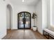 Bright entryway with hardwood floors, an arched doorway, and a modern light fixture at 635 San Fernando Dr, Smyrna, GA 30080