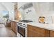 Modern kitchen detail showcasing a gas range and white subway tile backsplash at 635 San Fernando Dr, Smyrna, GA 30080