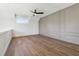 Spacious loft area with hardwood floors and ceiling fan at 635 San Fernando Dr, Smyrna, GA 30080