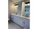 Elegant bathroom with double vanity, a quartz countertop and hexagon tile floor at 782 Post Road Way, Stone Mountain, GA 30088