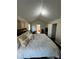 Spacious bedroom with dark hardwood floors and a king-size bed at 782 Post Road Way, Stone Mountain, GA 30088