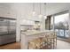 Modern kitchen with stainless steel appliances and an island at 1820 Peachtree Nw St # 303, Atlanta, GA 30309