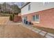 Brick patio and walkway leading to a private backyard at 3640 Rolling Creek Dr, Buford, GA 30519