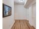 Unfinished basement hallway with hardwood floors and storage at 3640 Rolling Creek Dr, Buford, GA 30519